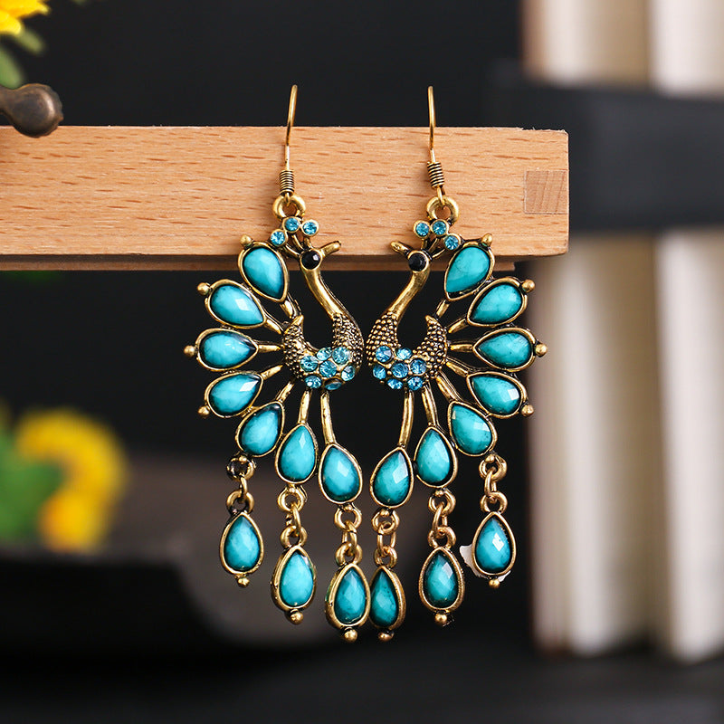 Vintage peacock ethnic style openwork earrings Personalized European and American earrings Dark green diamond-set alloy earrings