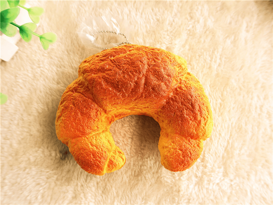 Croissant-Brot-Squishy, ​​13 cm, super langsam aufsteigend, Originalverpackung, Quetschspielzeug, lustiges Geschenk