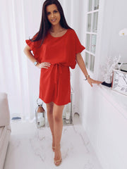 Solid color dress with ruffles and belt