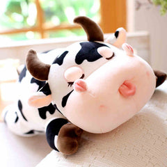 Peluche de vache mignonne endormie en peluche